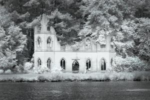 ruined abbey next to lake