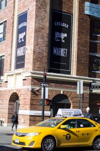 yellow taxi and Chelsea market sign