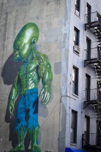 graffiti of green baby wearing denim cut-offs